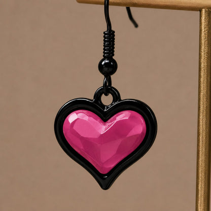 Faceted heart pendant detail on bubblegum goth sweetheart earrings