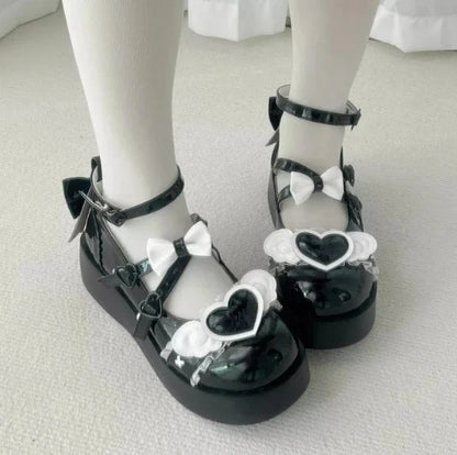 Deep black Cherub Heart Cutie Platforms with soft heart centerpiece and ethereal wing details, ideal for DDLG or gothic lolita style.