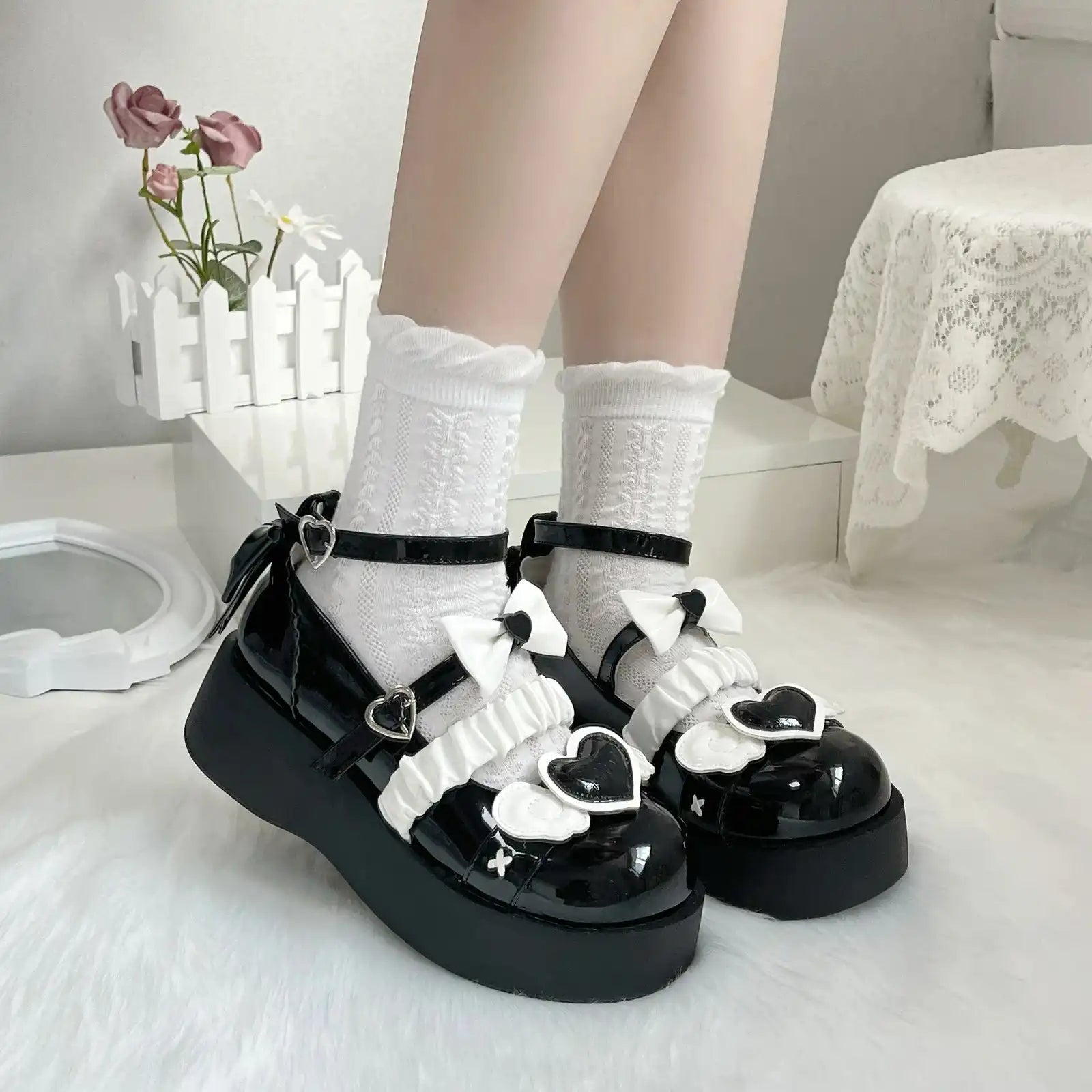 Deep black Cherub Heart Cutie Platforms with ethereal wing details and sweet heart accent for gothic lolita or ABDL style.