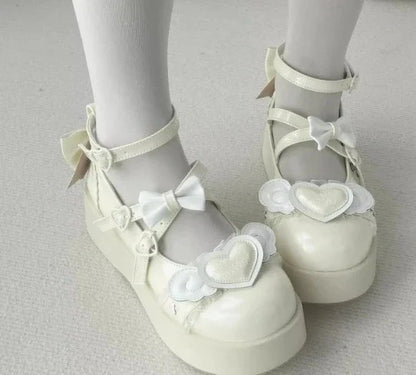 Pastel yellow Cherub Heart Cutie Platforms with fluttery angel wings and heart centerpiece, perfect for kawaii DDLG fashion.