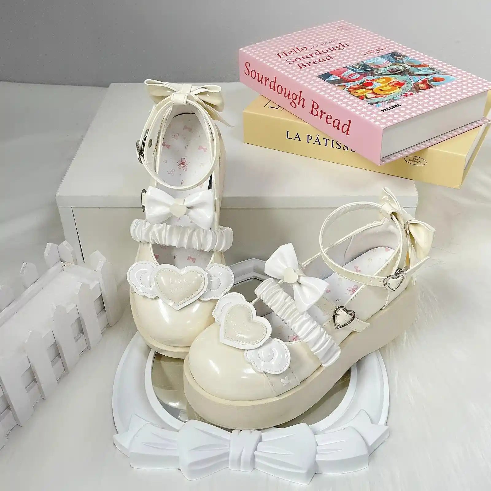 Pastel yellow Cherub Heart Cutie Platforms with dainty platform lift, fluttery wings, and heart centerpiece for kawaii style.