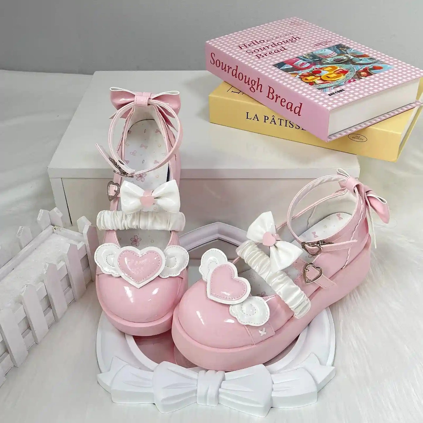 Pink Cherub Heart Cutie Platforms with angel wings and 3D bows, perfect for dreamy DDLG and lolita fashion looks.