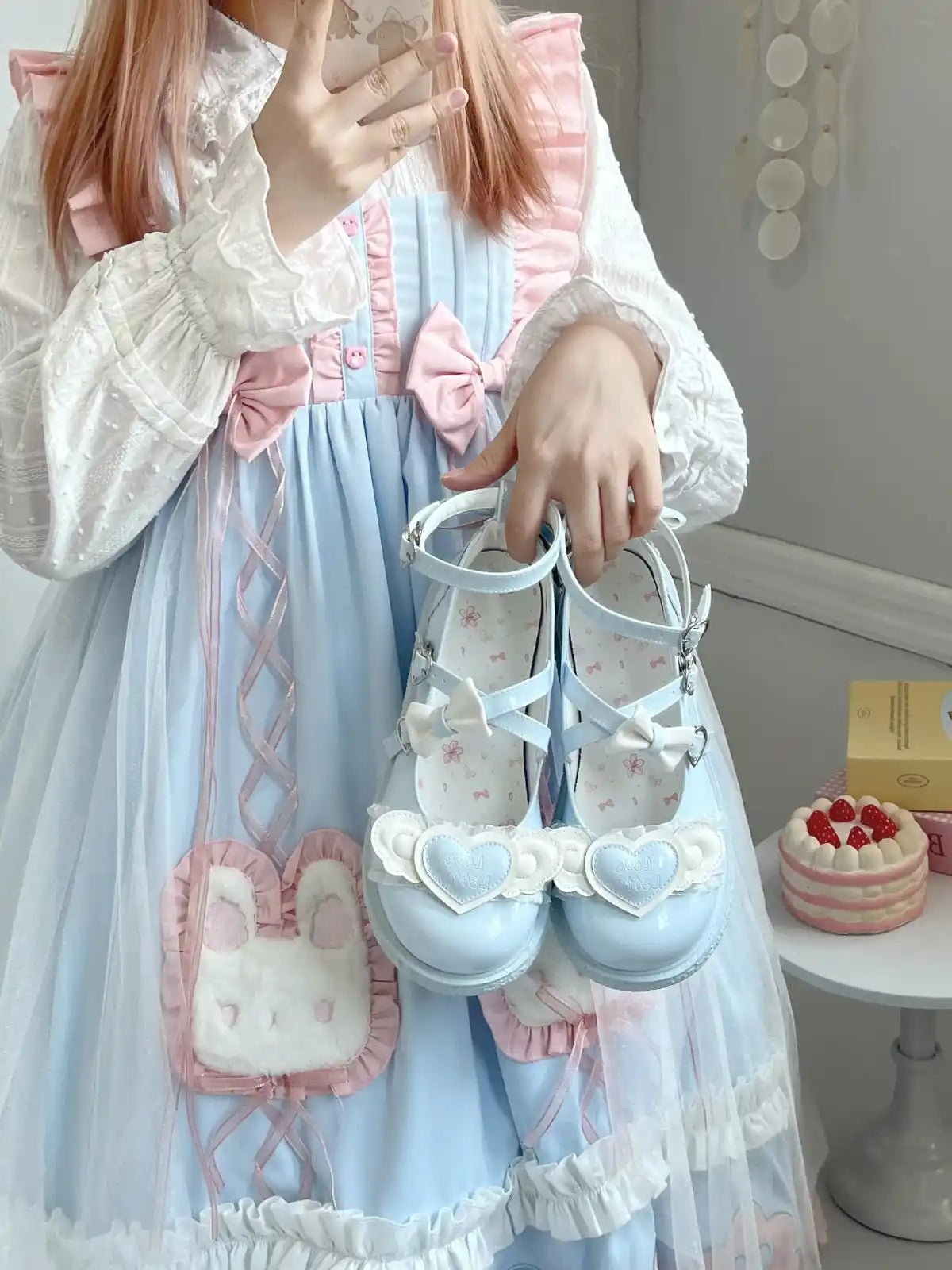 Soft blue Cherub Heart Cutie Platforms featuring raised heart centerpiece and delicate angel wings for kawaii aesthetic.