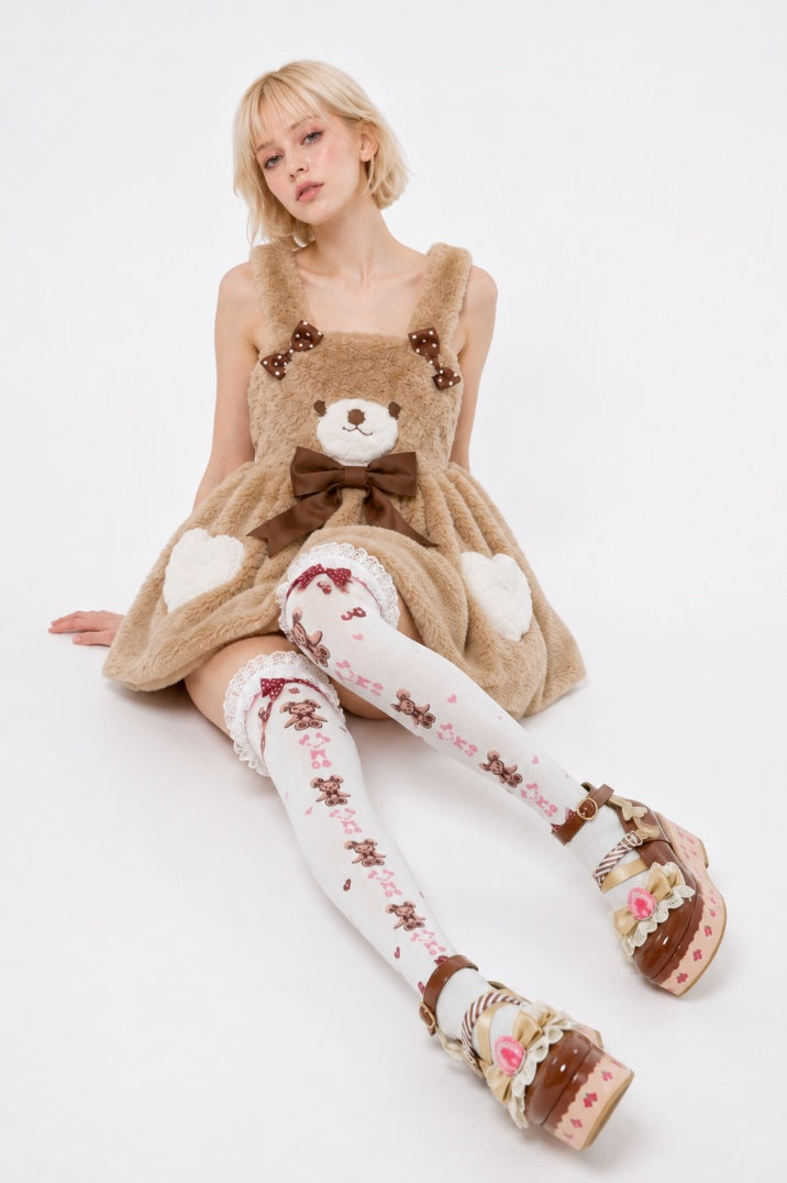 Model wearing Cocoa Bear coquette suspender dress showing cacao waist bow detail