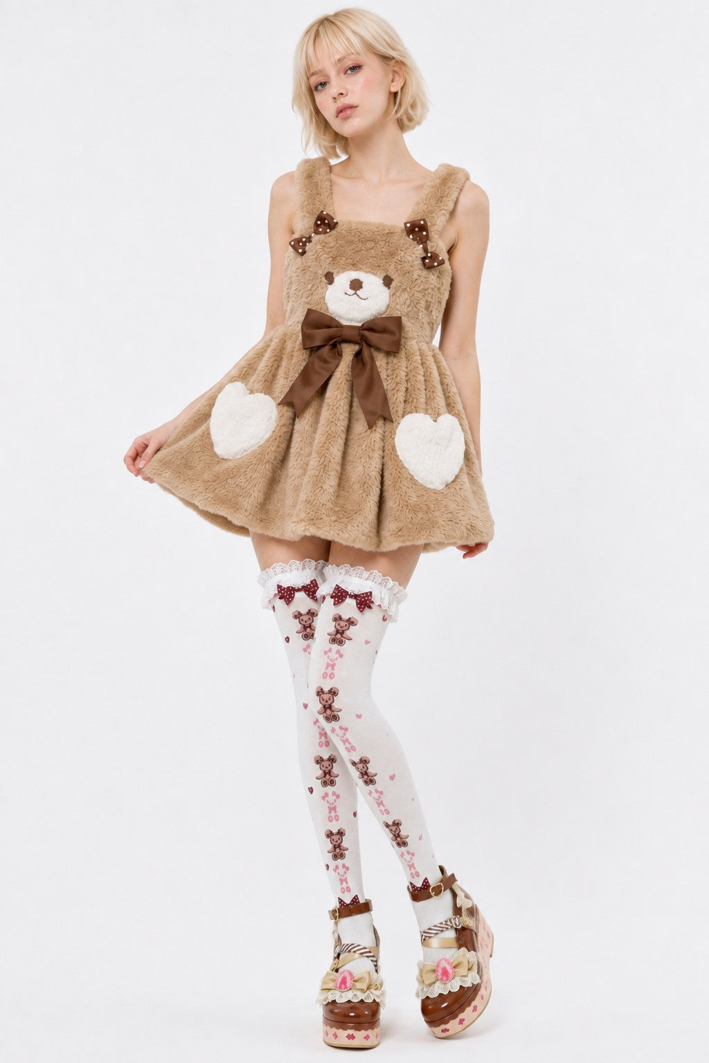 Model posing in Cocoa Bear coquette suspender dress, dollcore kawaii style