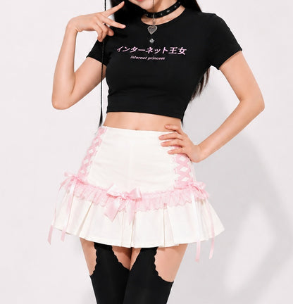 White coquette lace up pleated mini skirt with pastel pink bow accents, Jirai Kei style