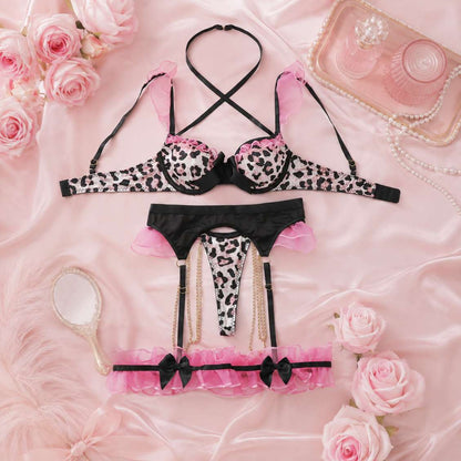 Delicate chain accent and heart hardware detail on leopard print strappy lingerie