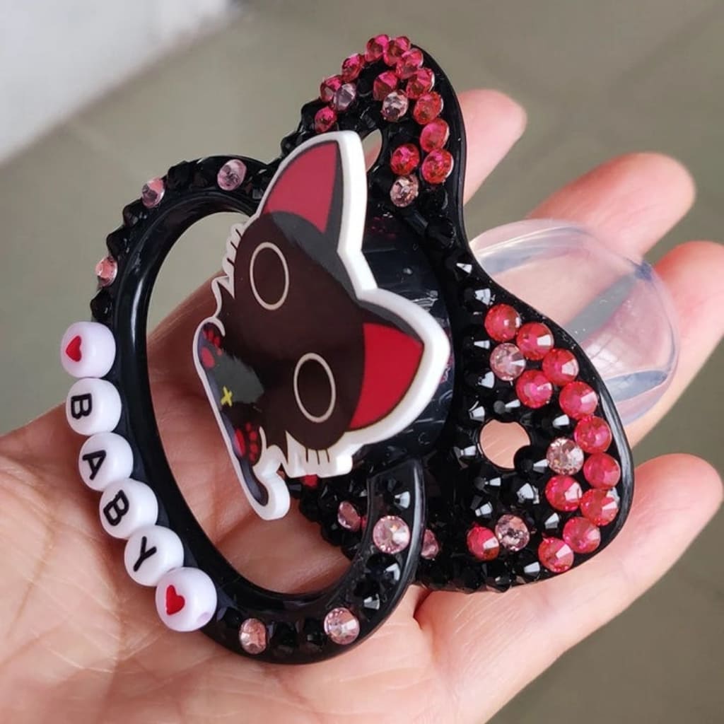 Silicone nipple pacifier with black cat theme and “baby” lettering, ideal for DDLG, ABDL, cosplay, and soft little space moments.