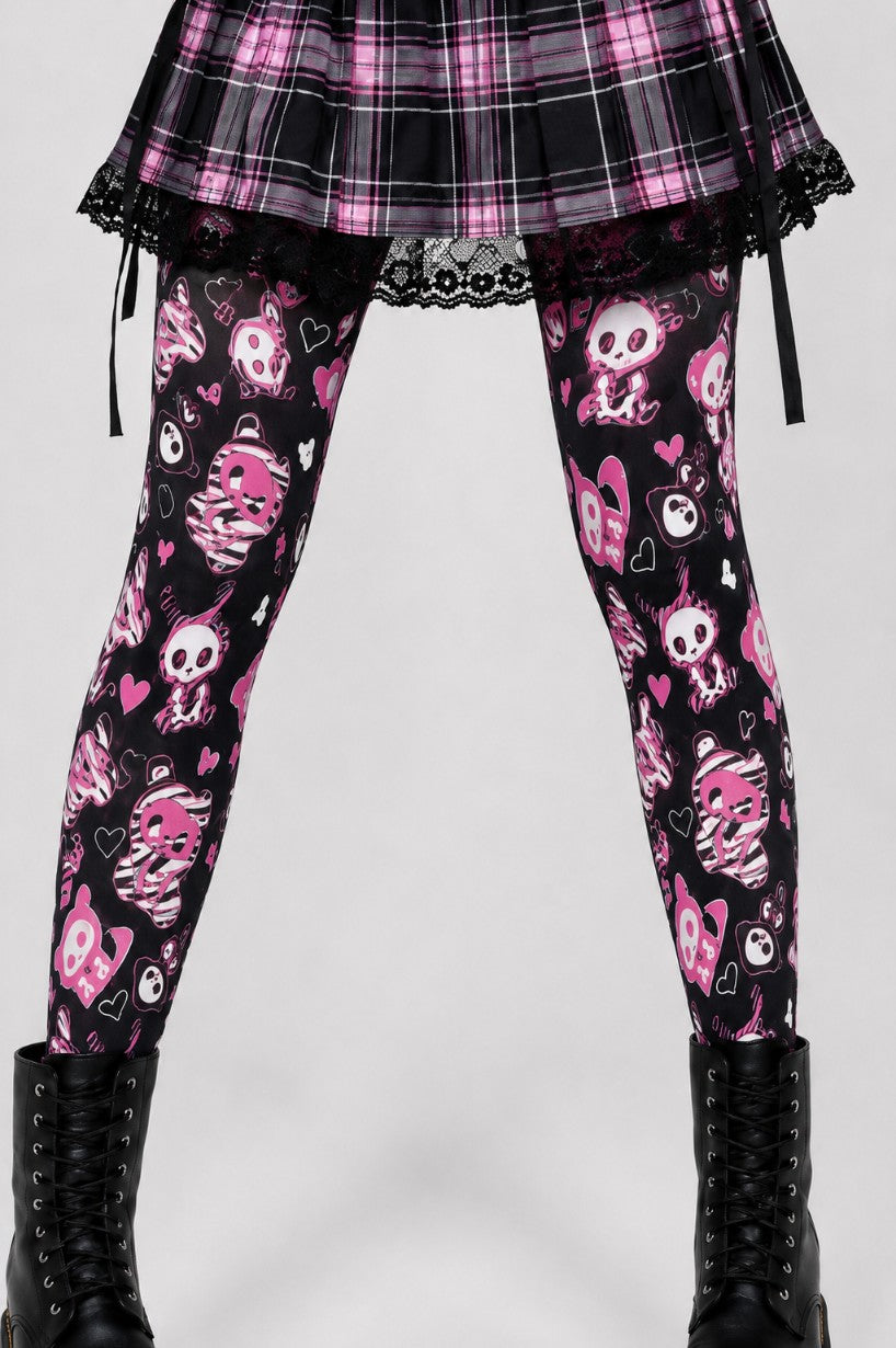 Close up of skeleton bunny print and scattered hearts on black kawaii goth tights