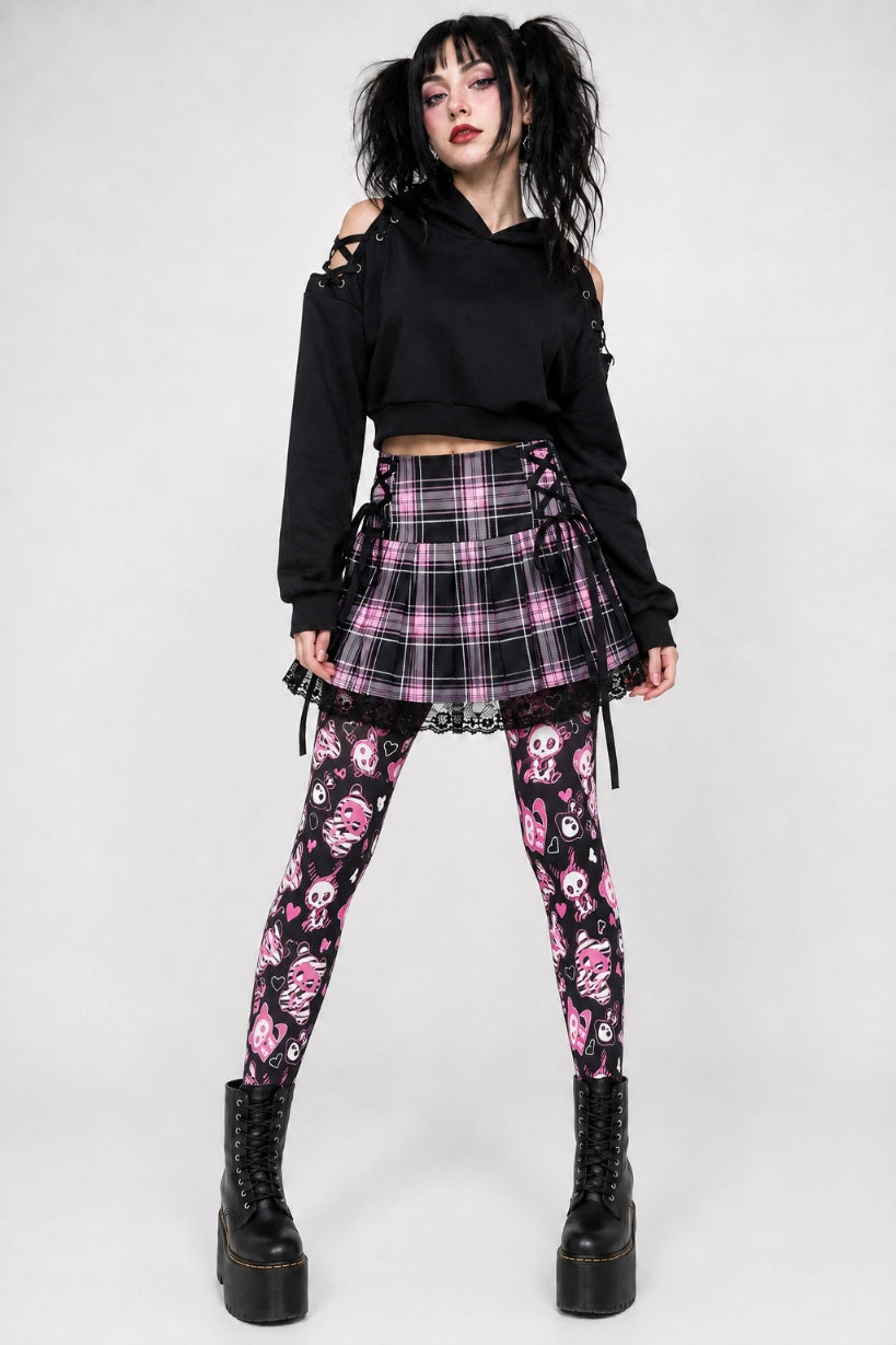 Model wearing spooky cute skeleton bunny tights with boots for alternative Halloween look