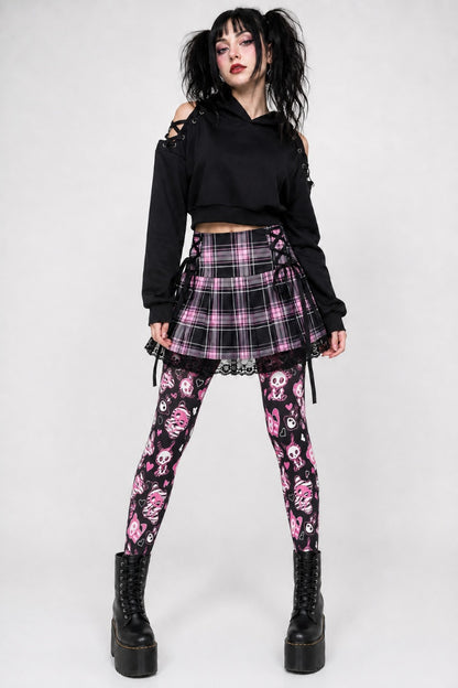 Model wearing spooky cute skeleton bunny tights with boots for alternative Halloween look