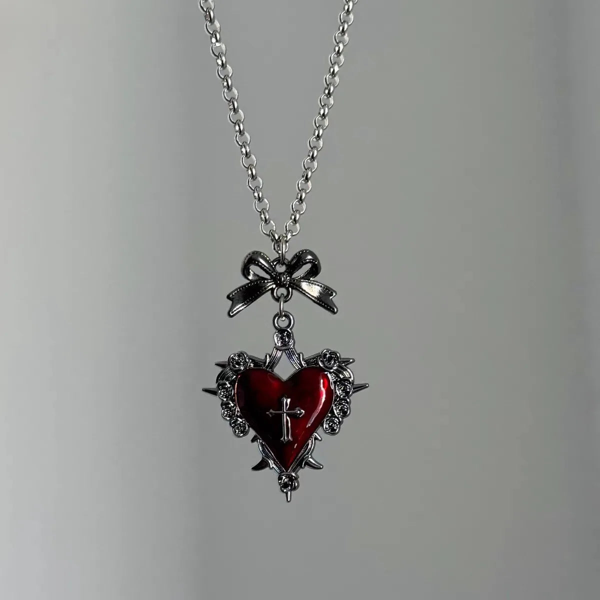 Red crimson thornheart necklace with silver thorns and soft ribbon detail, perfect for bratty kawaii vibes
