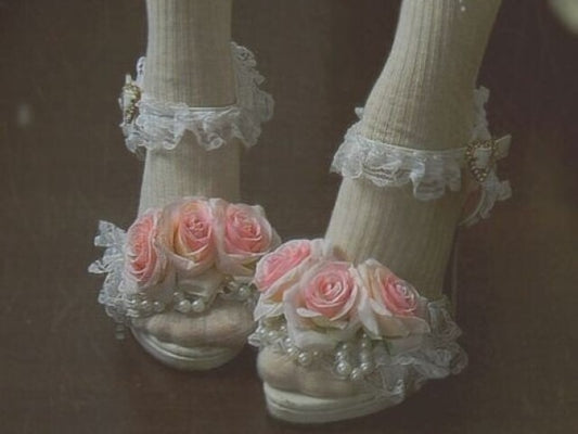 White heels decorated with pink roses, frills, and pearl accents — romantic princesscore shoes for dreamy outfits or special occasions.