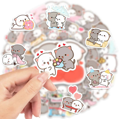 Cute Cat Couple stickers applied to a laptop lid styled for ABDL kawaii little space caregiver aesthetic