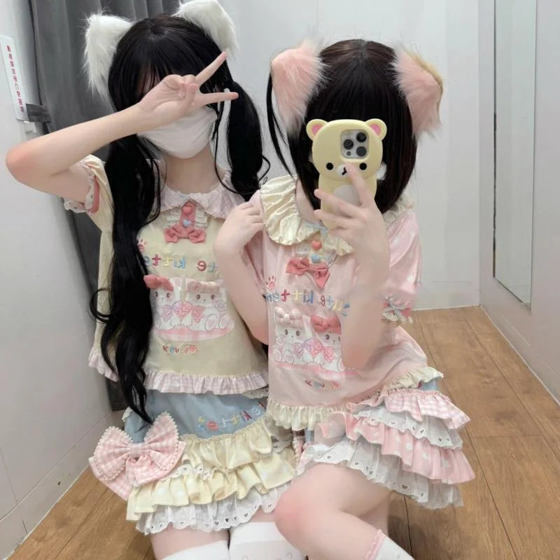 Cute kitten graphic tee with pastel skirt for a dreamy kawaii look