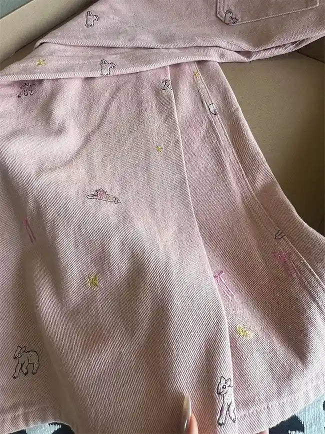 Soft pastel pink wide-leg denim pants with ribbon embroidery and dreamy ranchcore vibes