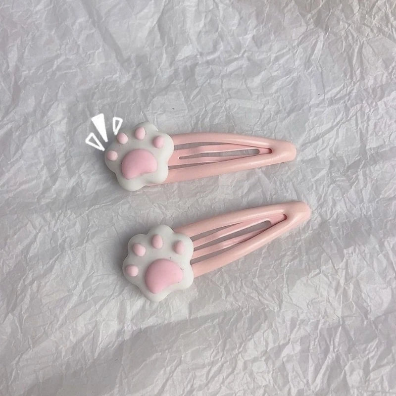 Cute pink paw hair clips with cartoon charm for kawaii lovers and DDLG fashion