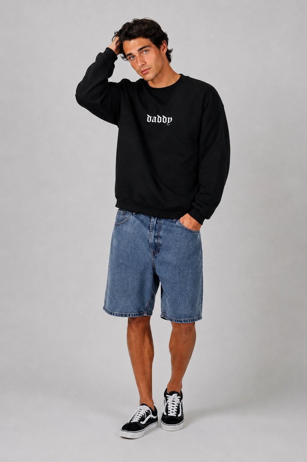 Man wearing black Daddy Energy sweater in a casual cozy lifestyle shot