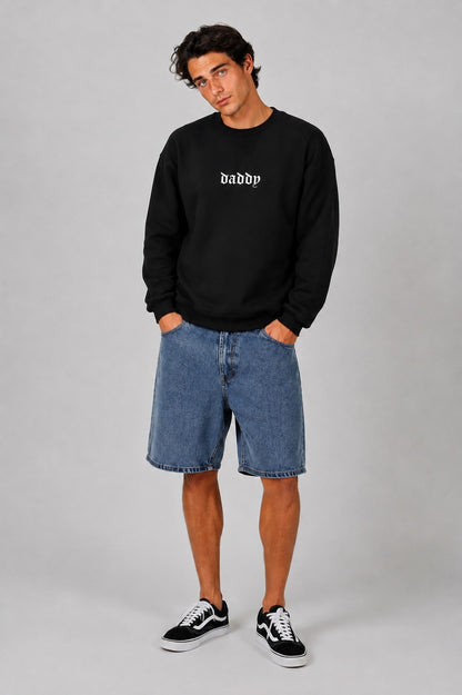Model wearing white Daddy Energy sweater with bold classic font print