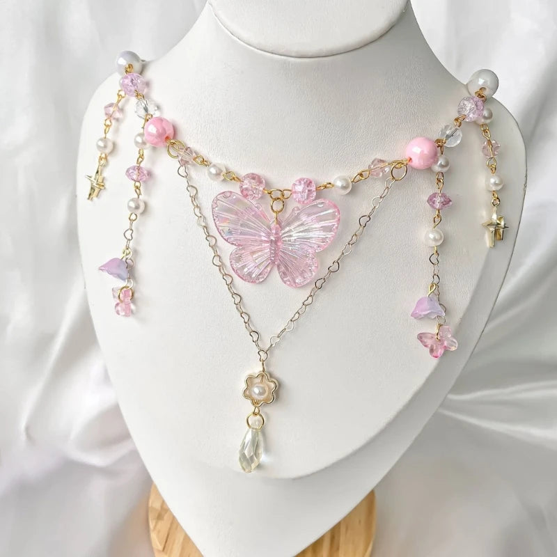 Dainty pink butterfly necklace with sparkling wings for dreamy and fairycore fashion looks