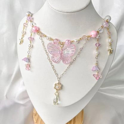 Dainty pink butterfly necklace with sparkling wings for dreamy and fairycore fashion looks
