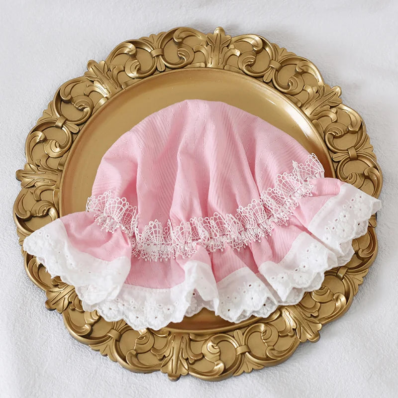 Girly pink lace bonnet with adjustable fit for sunny days