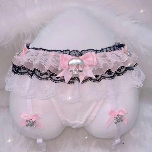 Black lace thong and garter set with skull accents, blending cute Harajuku and alt lingerie styles