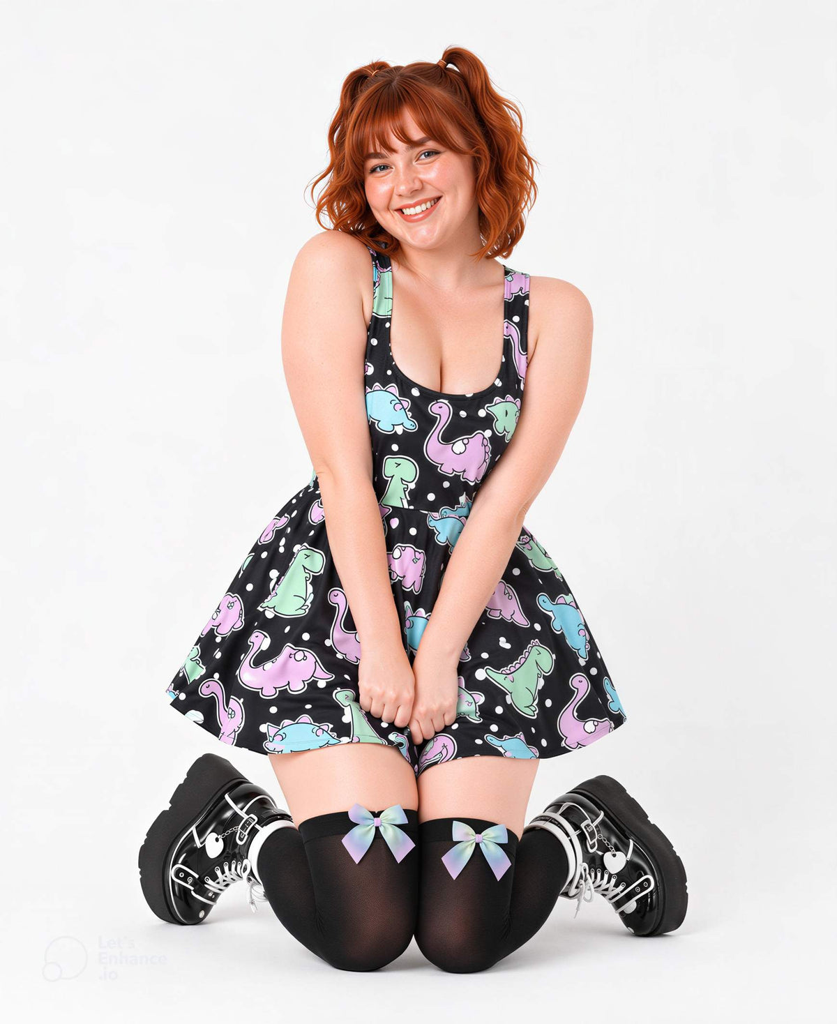 Model seated wearing Dino Party pastel polka dot dress, ABDL DDLG style