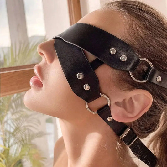 Close-up of double thick straps, vegan leather blindfold, bold and dominant aesthetic