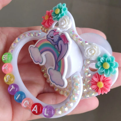 Eco-friendly BPA-free pacifier with dragon and rainbow design for magical little moments