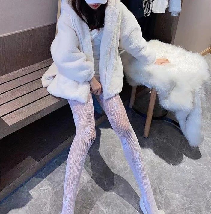 edgy kawaii skull fishnet tights with cute spooky details