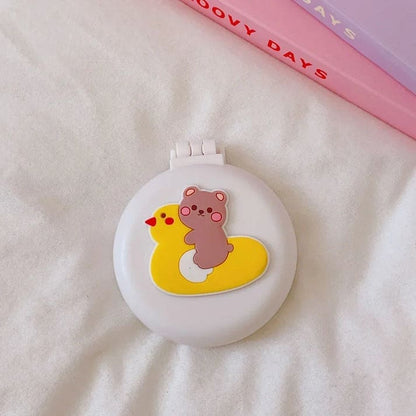 Compact brush and mirror set with kawaii bear on yellow duck design, foldable and perfect for littles or on-the-go grooming.