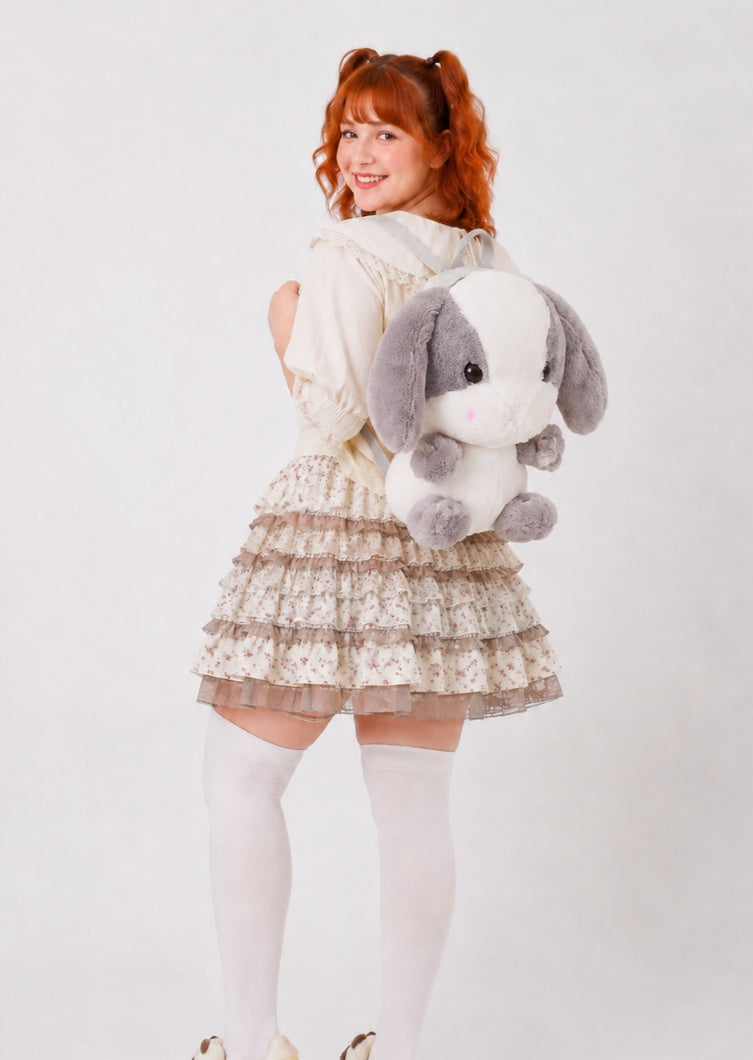 Oversized floppy ear detail on grey and white kawaii doll backpack