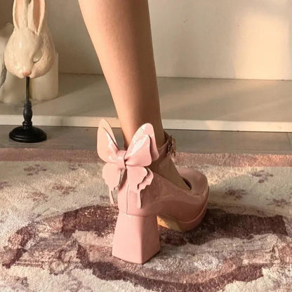 Rose pink Flutterbaby 3D butterfly heels with heart buckles for kawaii baddie, pastel dollcore, and TikTok-ready looks