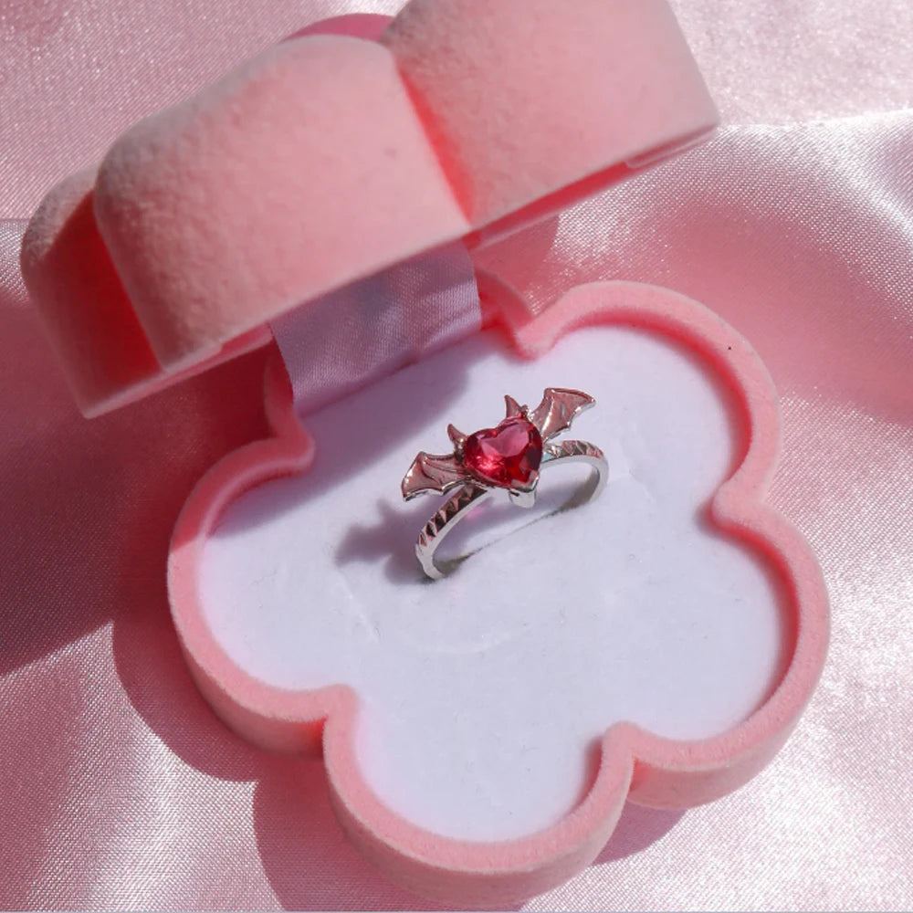 gothic heart ring with red pink heart centerpiece dark romance edgy style