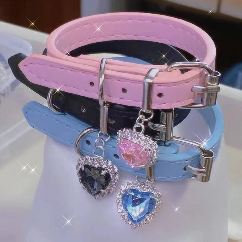 Multi-color vegan leather chokers in blue, black, and pink with sparkling heart charms