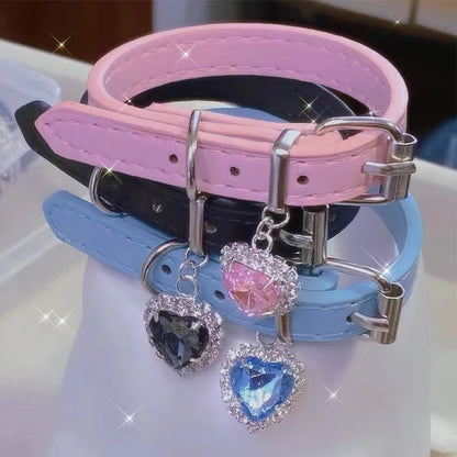 Multi-color vegan leather chokers in blue, black, and pink with sparkling heart charms
