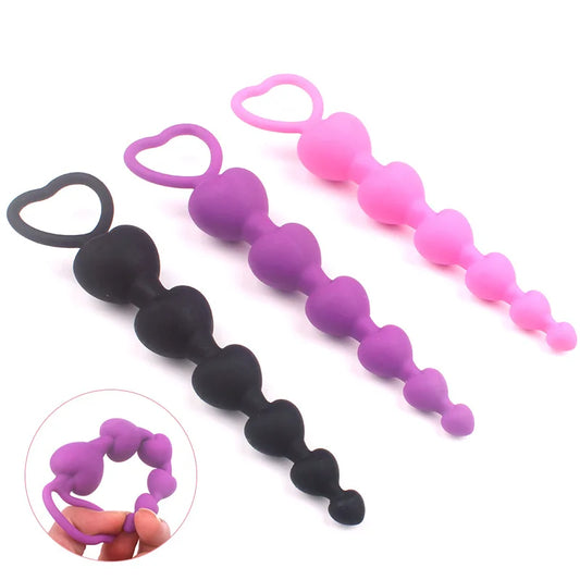 Heartbeat Skips Plug in Purple, Pink, and Black silicone with 6 graduated hearts, flirty babygirl cutecore ddlg vibes