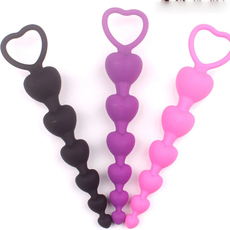 Heartbeat Skips Plug trio in Purple, Pink, and Black silicone, kawaii flirty babygirl ddlg accessory with 6 hearts