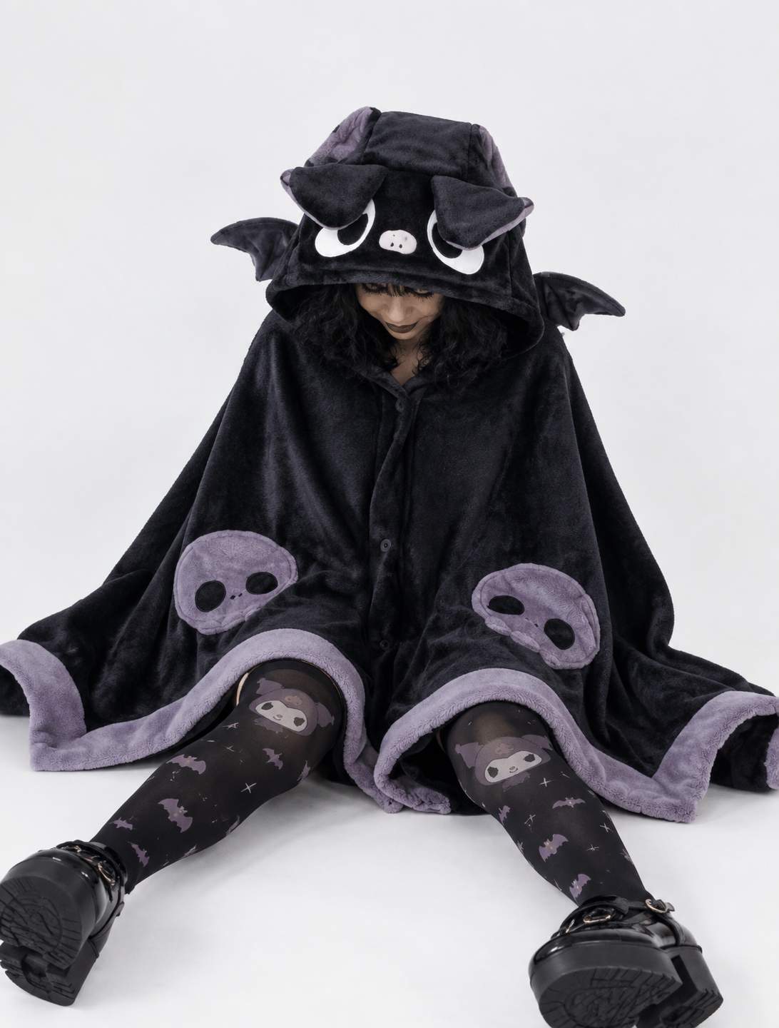 Model wearing Kawaii Baby Bat blanket cape while gaming, cozy DDLGirl style