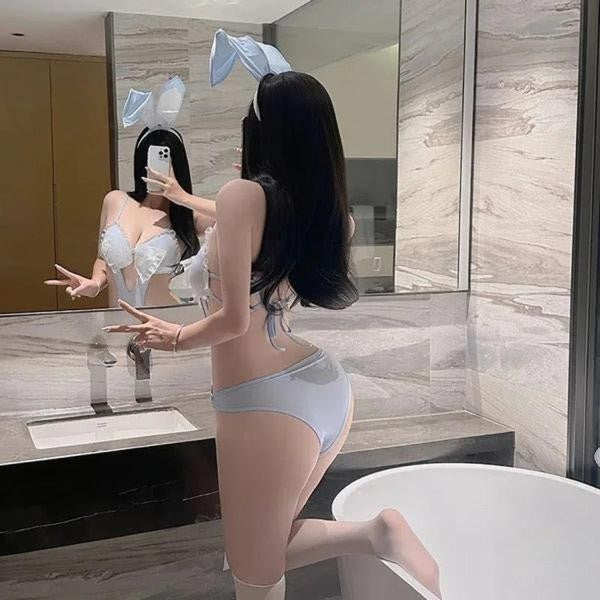 Back view of Baby Blue Bunny Bodysuit Set with hip rings, kawaii ears, and layered pastel cutecore outfit