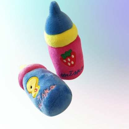 Flat lay of kawaii bottle plush squeaky toy, DDLG ABDL little space accessory
