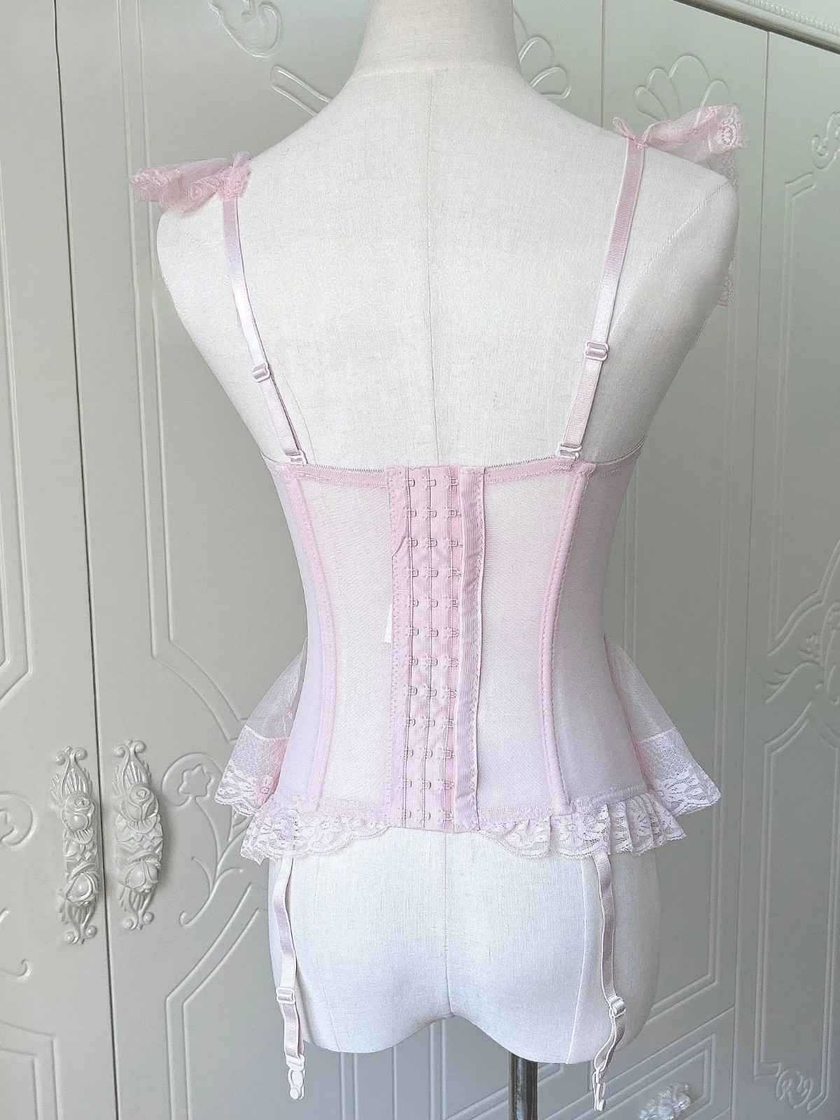 Kawaii doll pink lingerie corset with lace ruffles, mini bows, and adjustable lacing for DDLG roleplay