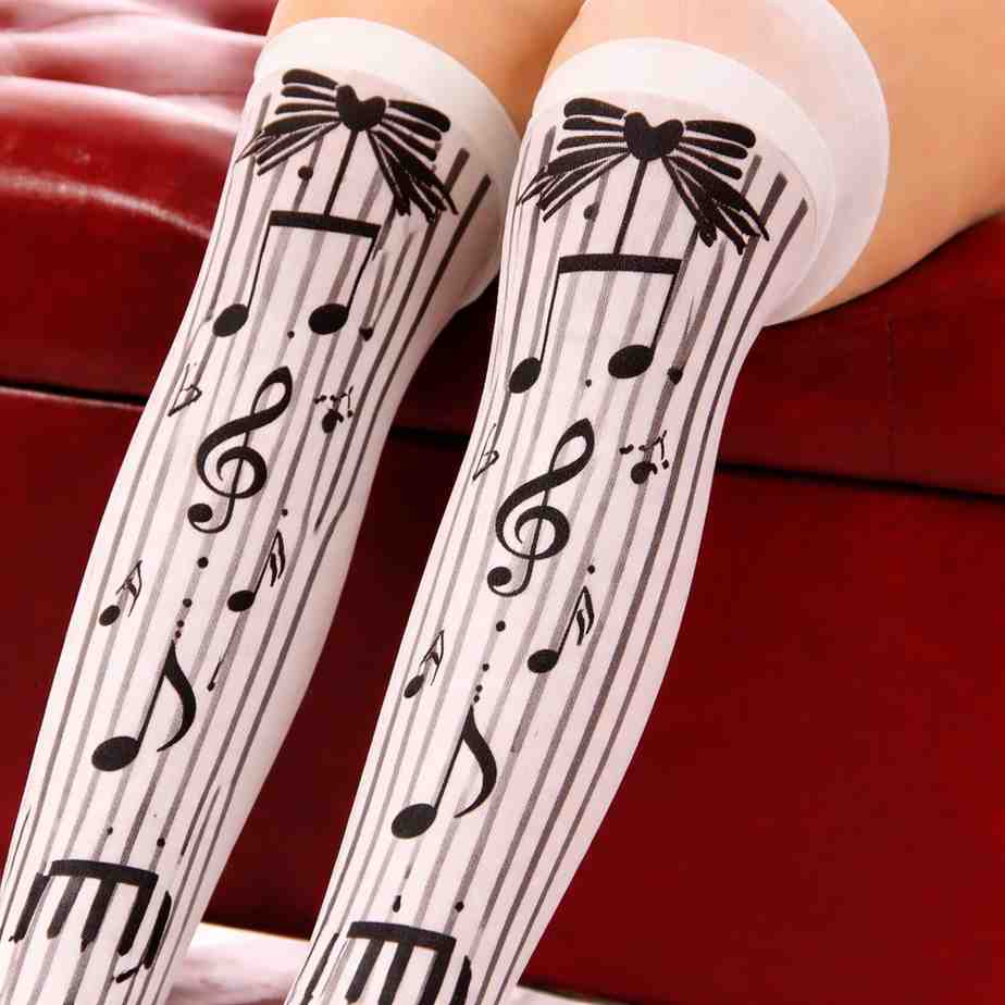 Kawaii melody note stockings with pastel ribbons, hearts, and music notes for cutecore DDLG fashion