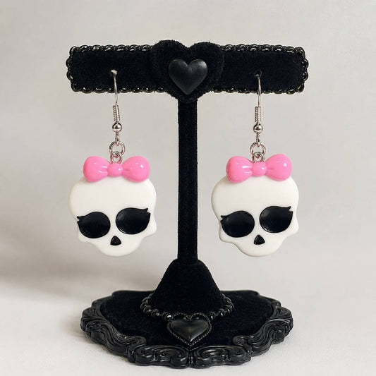 Kawaii monster babygirl bow earrings with glossy skull charms, DDLGirl style
