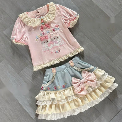 Kawaii fashion set with kitten print, bows, and heart accents in pastel colors