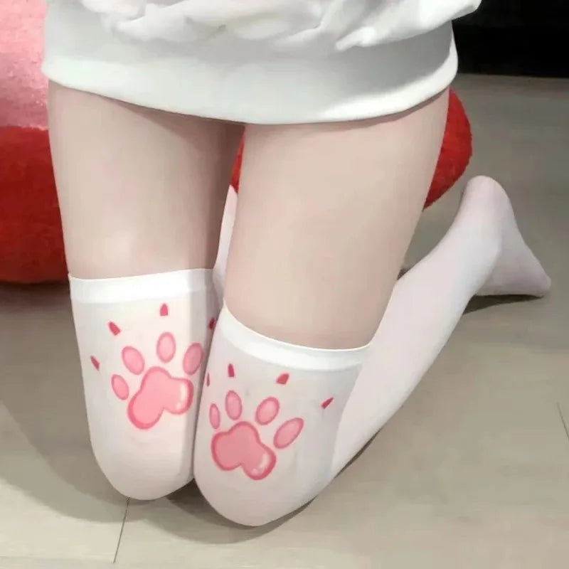 Kawaii pink paw stockings with cartoon designs, perfect for playful cutecore and softgirl DDLG outfits