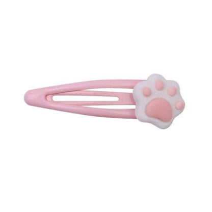 Soft pink paw hair clip designed for kawaii, ABDL, and pastel fashion fans
