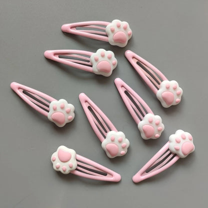 Lightweight pink paw hair clips perfect for kawaii, ABDL, and playful dress-up looks