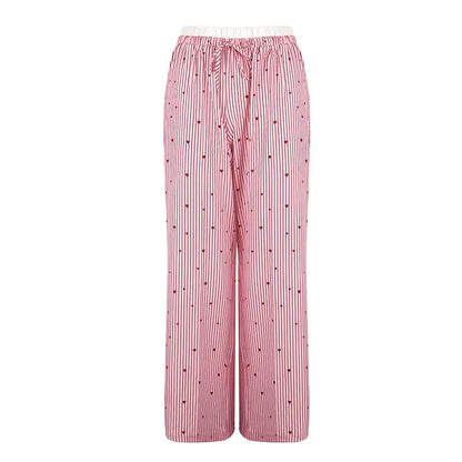 Flirty pink striped lace pants with heart lace-up detail, perfect for kawaii, dollcore, and DDLG aesthetics
